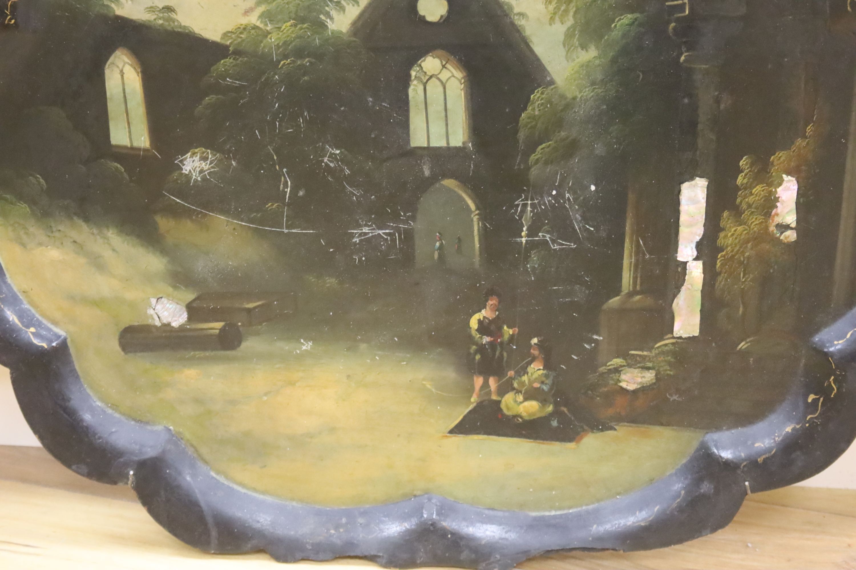 A Victorian papier mache tray, painted with Orientalist figures amongst ruins, 75cm (a.f.)